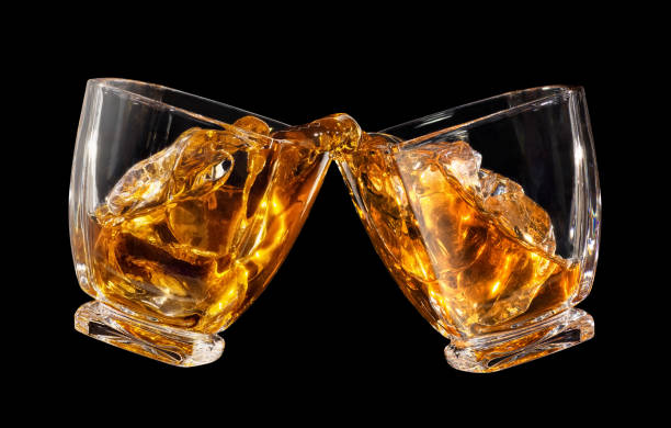 istock glasses of whiskey making toast 1142962466