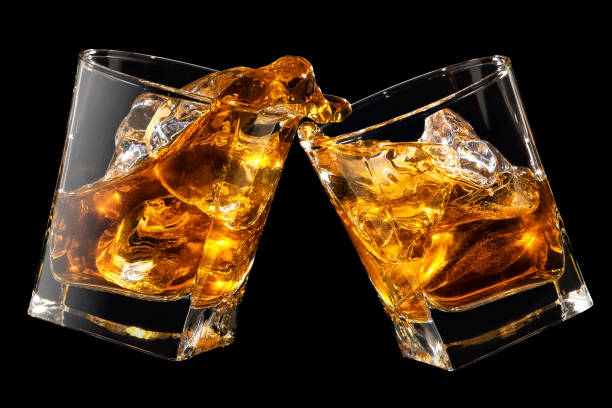 istock glasses of whiskey making toast 1142962481