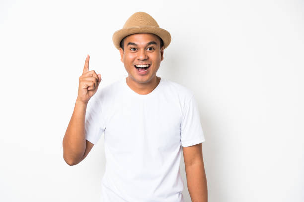 istock Young happy&funny asian man pointing finger on blank space for text. 1142964369