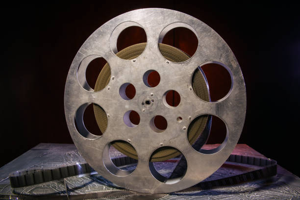 istock 35 mm film reel with dramatic lighting on a dark background 1142965608
