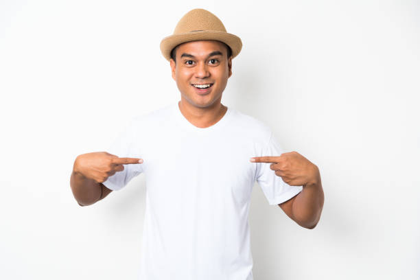 istock Young asian man pointing finger on shirt on isolate background. 1142965742