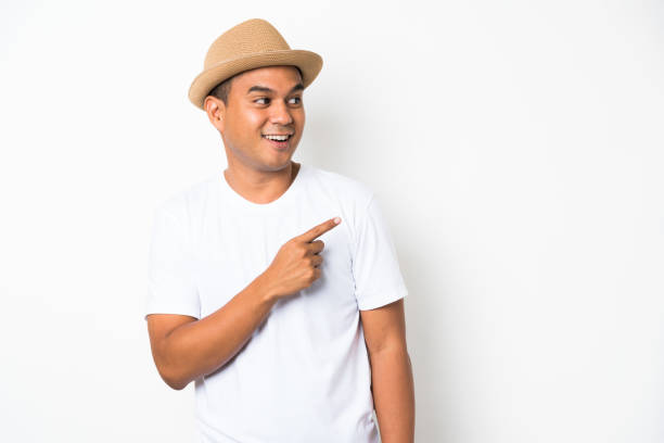 istock Young happy&funny asian man pointing finger on blank space for text. 1142965769