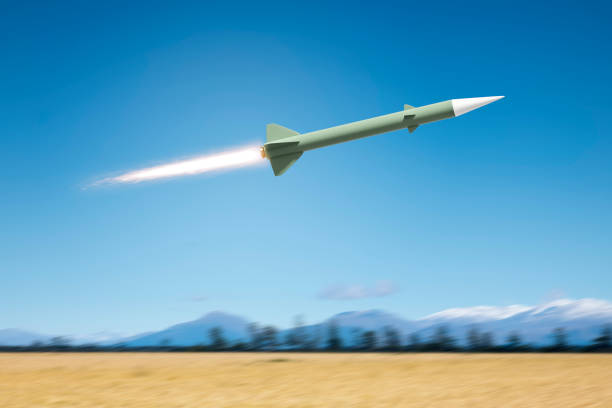 istock nuclear rocket bomb flying over a landscape field 1142967544