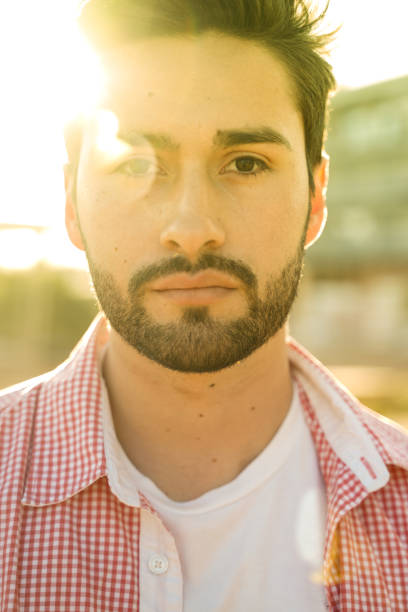 istock Stylish young man under city sun 1142970458