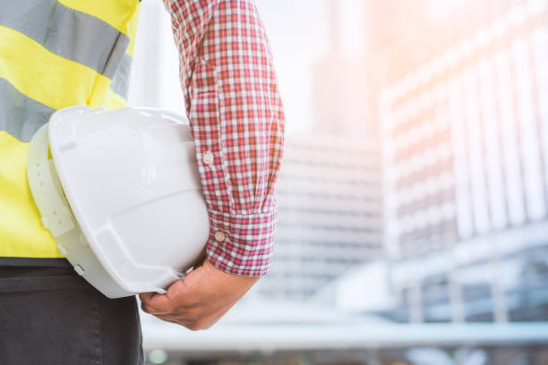 istock Young civil engineer standing near construction building. 1142970533