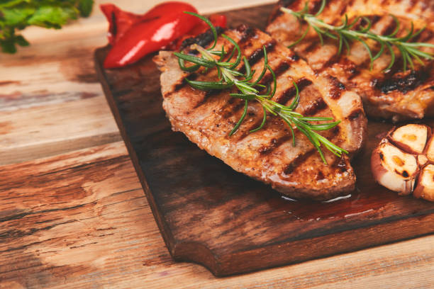 istock Steak pork grill on wooden cutting board 1142970722