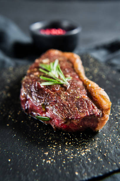 istock Beef ramp steak with rosemary. Black background, top view. 1142971632