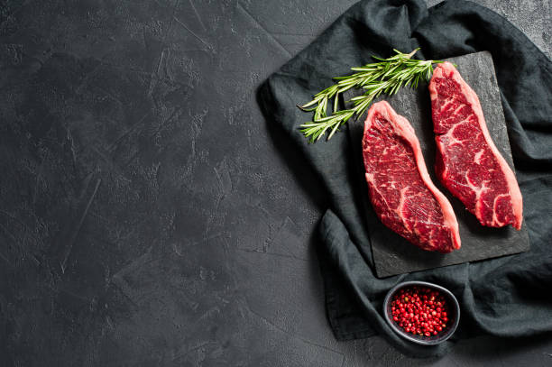 istock Raw beef ramp steak. Black background, top view. 1142971918
