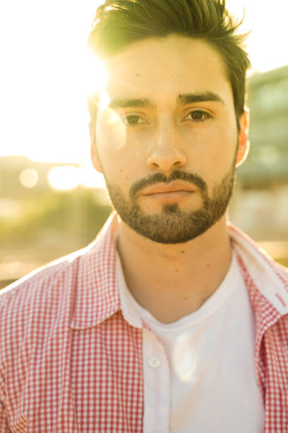 istock Stylish young man under city sun 1142971932
