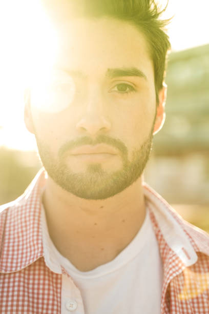 istock Stylish young man under city sun 1142972357