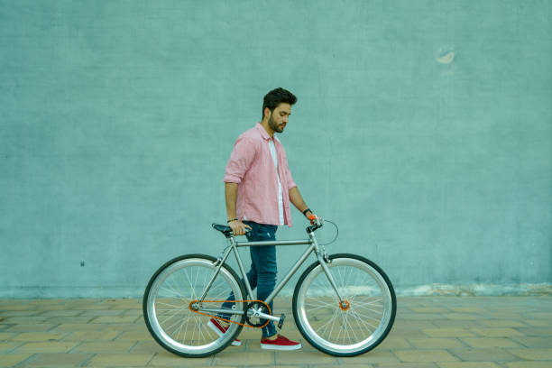 istock Cyclist walking in the street. 1142973044