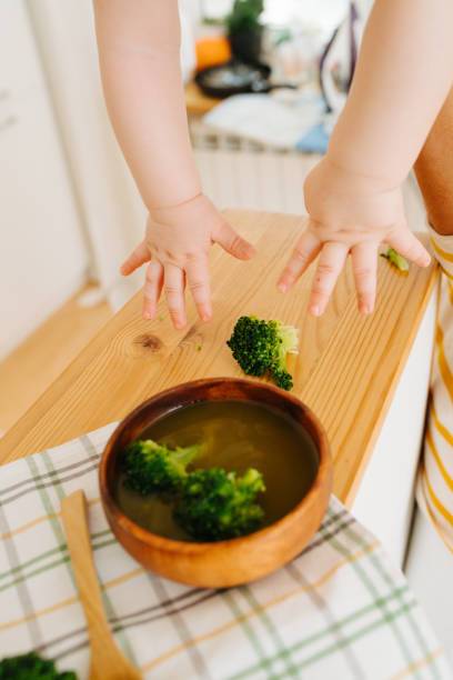 istock Active restless infant child is given food 1142974097