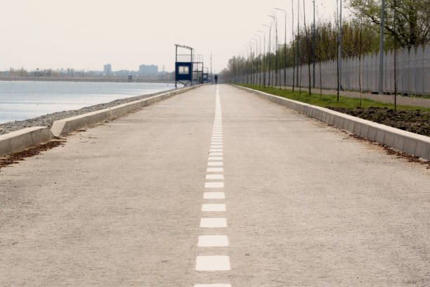 istock highway with a dividing strip goes into the distance 1142975422