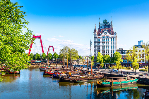 Rotterdam, South Holland, The Netherlands - May, 2018: Oude Haven harbor, Willemsbrug bridge, old ship yard dock, Ships, Openlucht Binnenvaart Museum during sunny summer day in Rotterdam