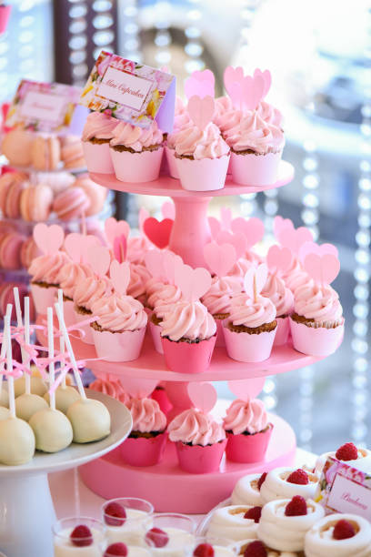 istock Delicious pink cupcakes on stander 1142977775