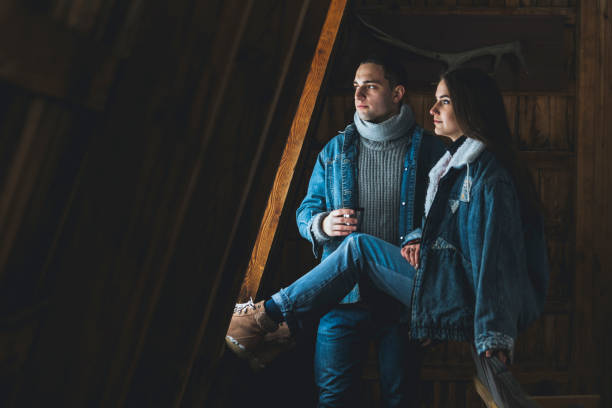 istock Couple share a hot beverage in a cabin 1142979234