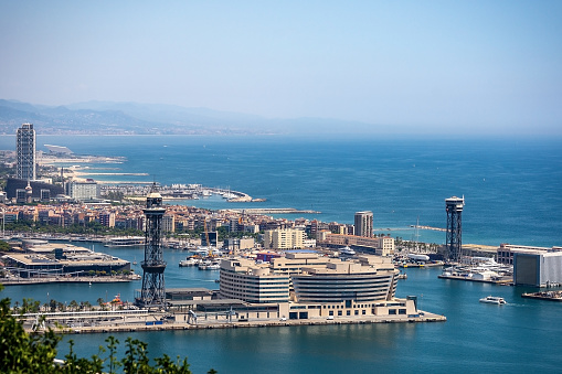 Barcelona, aerial view of Port Vell from Montjuic hill with the Mediterranean sea and coastline. Catalonia, Spain, Europe