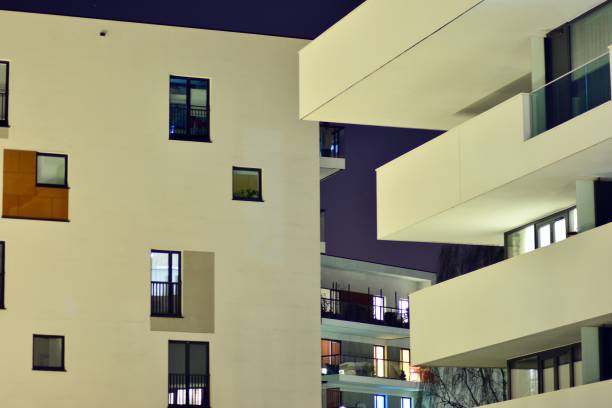 istock Exterior of apartment building at night 1142985183