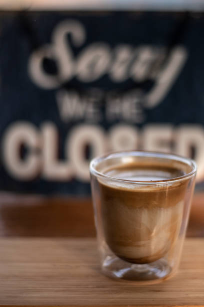 Hot latte layer coffee on small shot glass