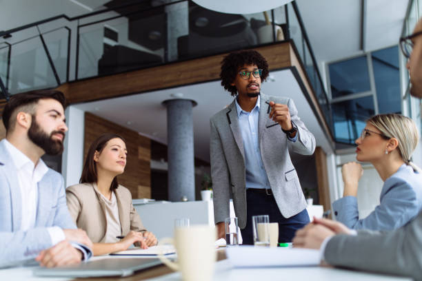 istock Young businessman giving presentation in the office 1142986398