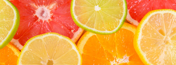 istock Colorful Citrus fresh fruits including grapefruit, lime, lemon and orange cross section studio shot 1142987509