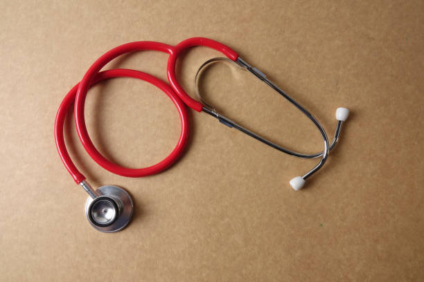 istock Directly Above Shot Of Stethoscope On Brown Table 1142988097