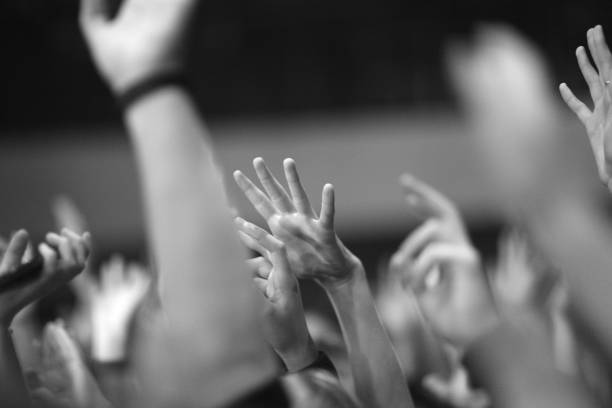 istock Raised hands of fans 1142988259