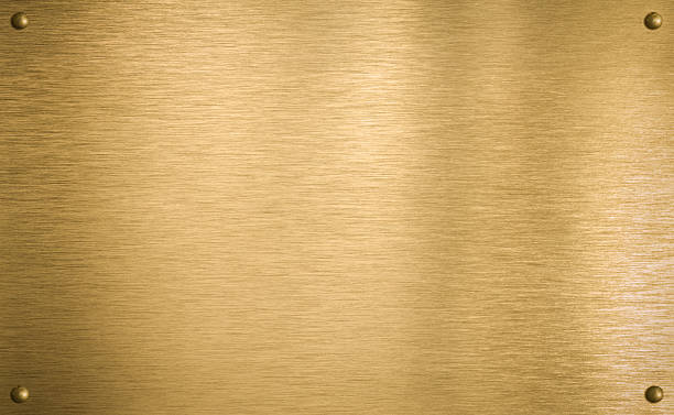 istock Brass or gold metal plate with four rivets 114298846