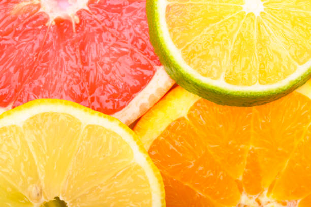 istock Colorful Citrus fresh fruits including grapefruit, lime, lemon and orange cross section studio shot 1142988682