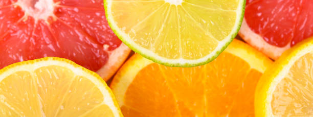 istock Colorful Citrus fresh fruits including grapefruit, lime, lemon and orange cross section studio shot 1142988918