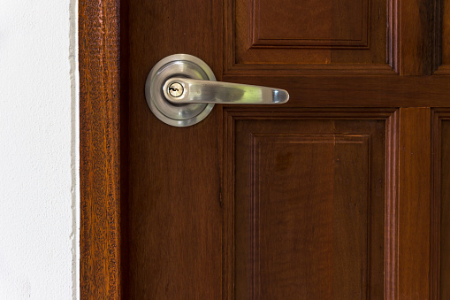 Doorknob on an Open Red Door