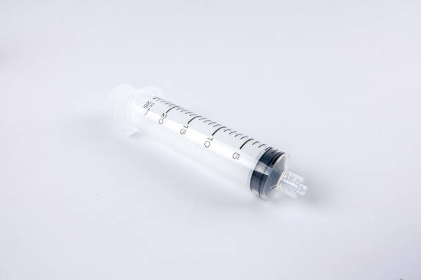istock Close-Up Of Syringe Over White Background 1142993097