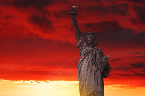 Statue of Liberty in the background of skyscrapers in Manhattan. New York, USA