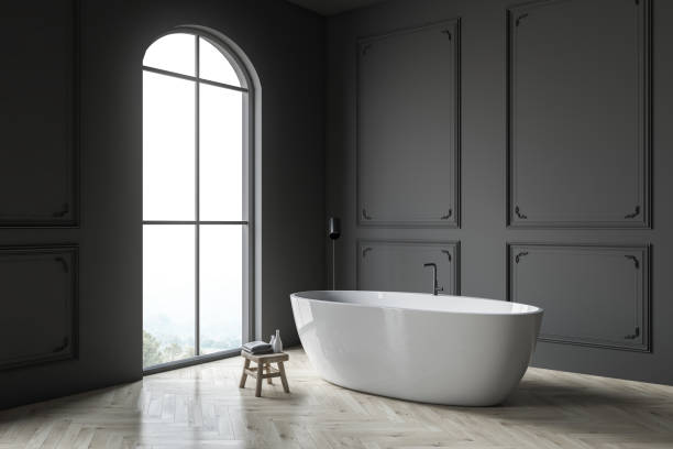 istock Gray bathroom corner with tub 1142994952