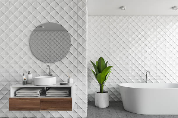 istock White tile bathroom interior, tub and sink 1142996391