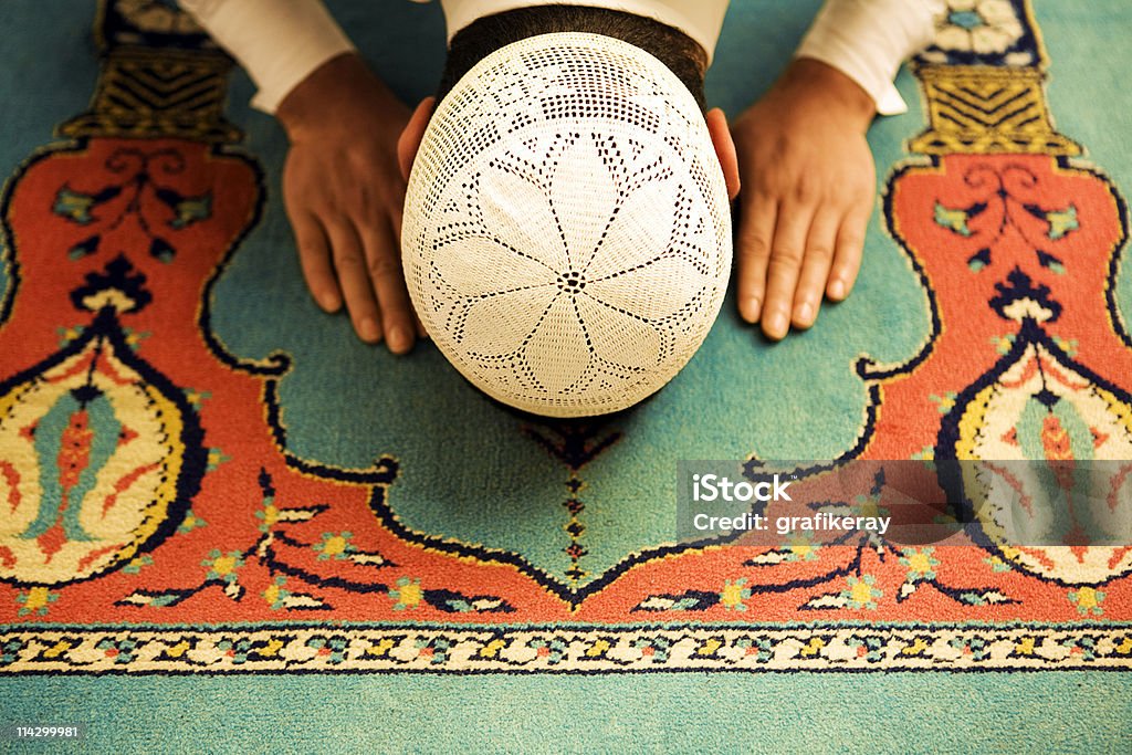 Praying people sajdah Interior mosque and praying people. Islam Stock Photo