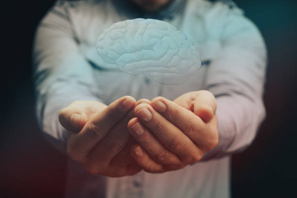 istock Human holding brain in palm. Mixed media. Innovative technologies. 1143000614