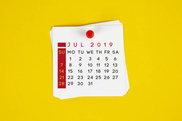 istock Post It July 2019 Calendar On Yellow Background 1143003301