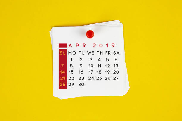 istock Post It April 2019 Calendar On Yellow Background 1143003480