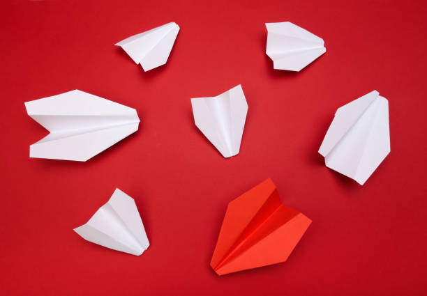 istock winner red  paper aircraft on red background - Image 1143004124