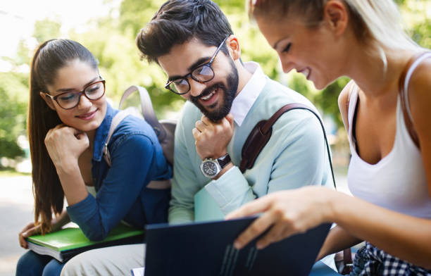 istock Group of friends studying together at university campus 1143005228