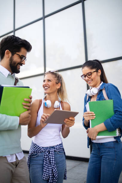 istock Group of friends studying together at university campus 1143005239