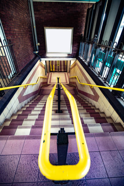 Empty Advertisement Poster Above Staircase to Subway
