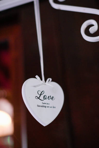 istock Beautiful white hearth hanged in restaurant with message of Love 1143007200