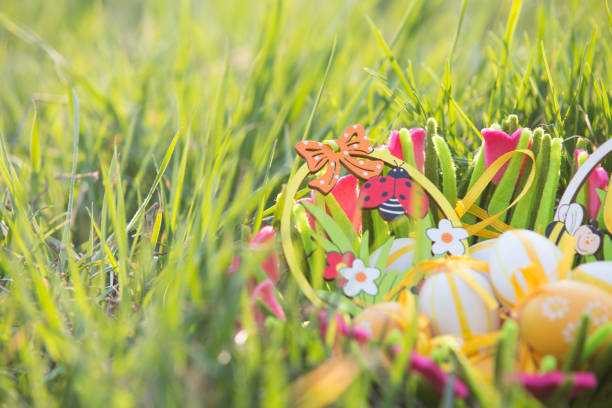 Easter eggs in a basket in the grass