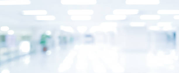 istock abstract blurred modern interior of office hospital in panoramic background with light form lamp ceiling building for banner design 1143010791