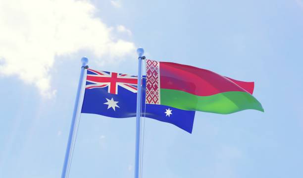 istock Australia and Belarus, two flags waving against blue sky 1143010849