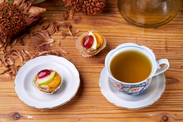 istock fruit tart and beverages on wood table 1143012281
