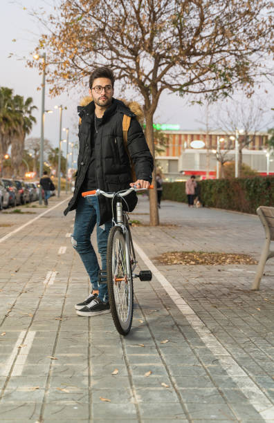 istock Cyclist walking in the street. 1143013163