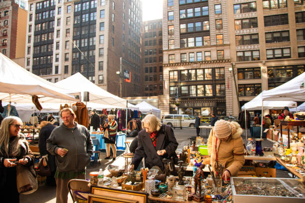Barcelona (Catalonia, Spain) - January 8, 2022: Unidentified people choose a product among the stalls of Barcelona's most famous flea market, located in the Glories district.
